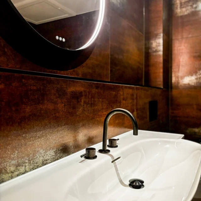 Kicking off 2025 with this GORGEOUS installation ❤️‍🔥

The first room of three completed and we are loving this beaut @mandarinstoneofficial tile paired with the gunmetal brassware. A his bathroom, and we’re definitely feeling the vibe. 

Stay tuned for hers ☺️

Swipe to see the before 🤯

#bathroominstallation #bathroominstallations #bathroomidea #mensbathroom #burntorange #walkinshower